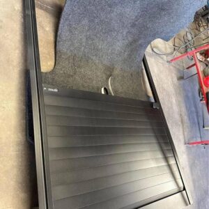 Retracting truck bed cover