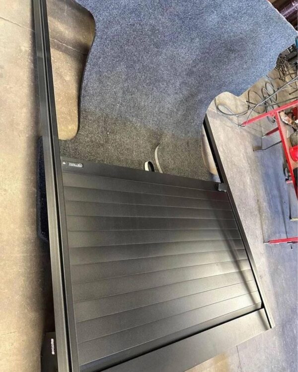 Retracting truck bed cover