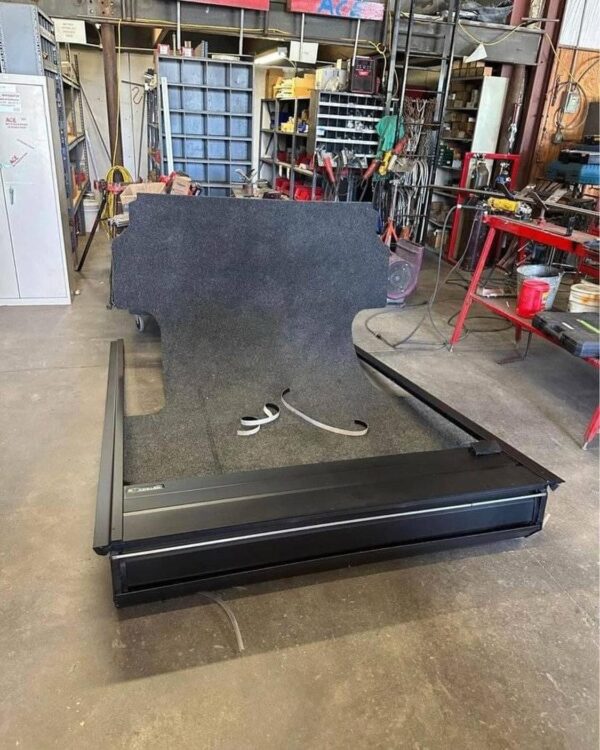 Retracting truck bed cover